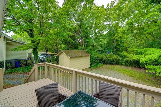 wooden deck with a shed, an outdoor structure, and stairway