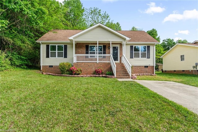 view of front of property featuring a front yard, roof with shingles, covered porch, and crawl space