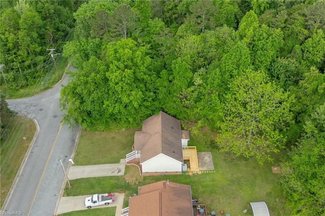 bird's eye view featuring a forest view