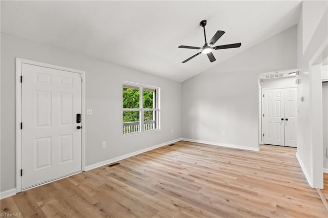 foyer entrance with ceiling fan, high vaulted ceiling, light wood-style flooring, baseboards, and visible vents
