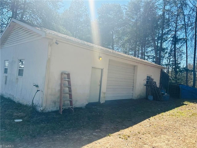 garage featuring driveway