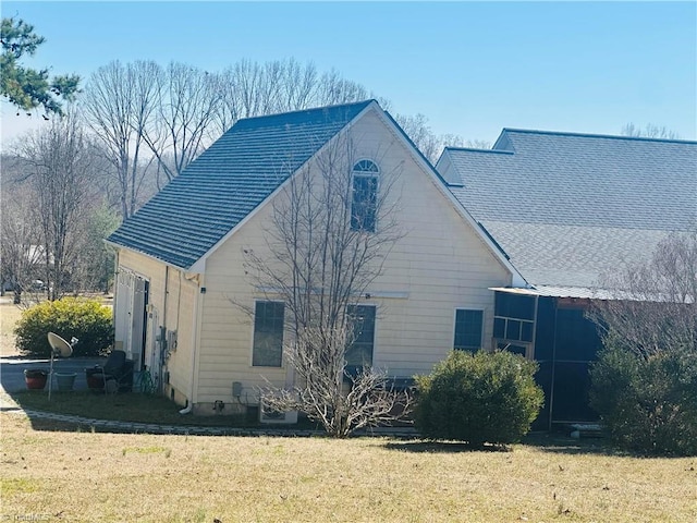 view of property exterior featuring a lawn