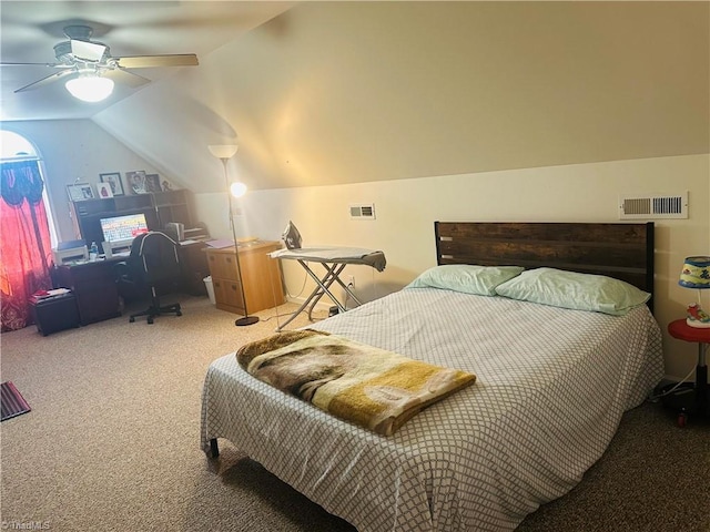 carpeted bedroom featuring a ceiling fan, vaulted ceiling, and visible vents
