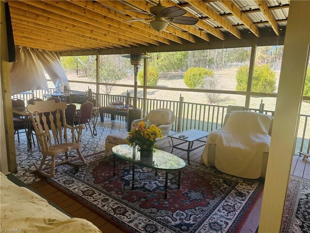 sunroom with a ceiling fan