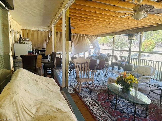 living area with ceiling fan