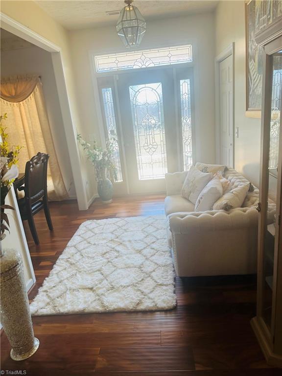 entryway featuring dark wood-style flooring