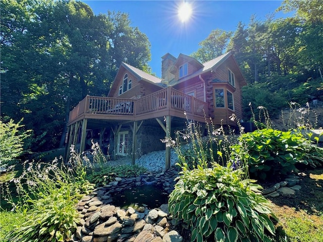 view of home's exterior featuring a wooden deck