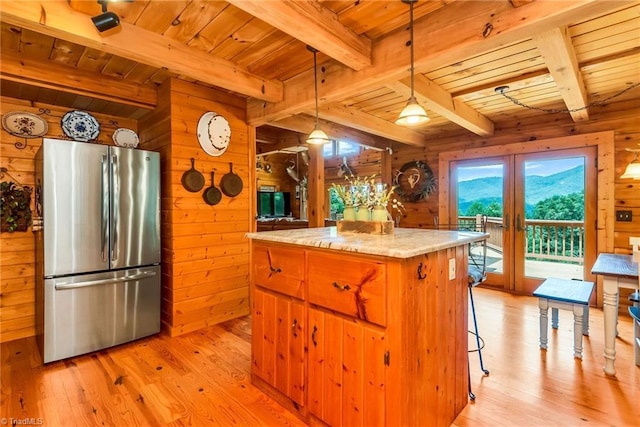 kitchen featuring wooden ceiling, wooden walls, french doors, and freestanding refrigerator