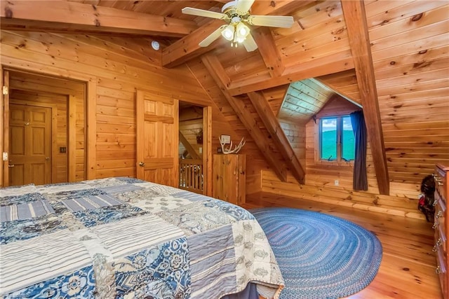 bedroom with wooden ceiling, wood walls, lofted ceiling with beams, and wood finished floors