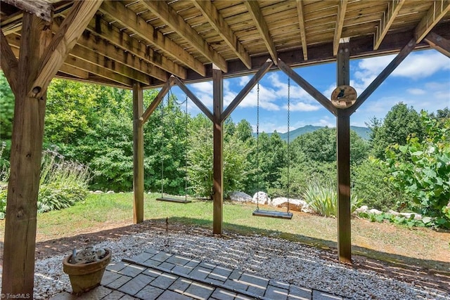 view of patio / terrace with a forest view