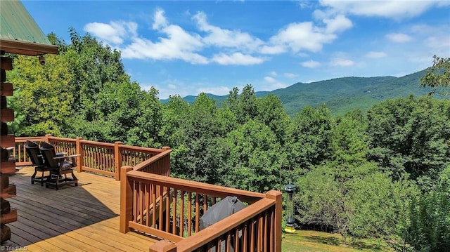 wooden deck featuring a mountain view