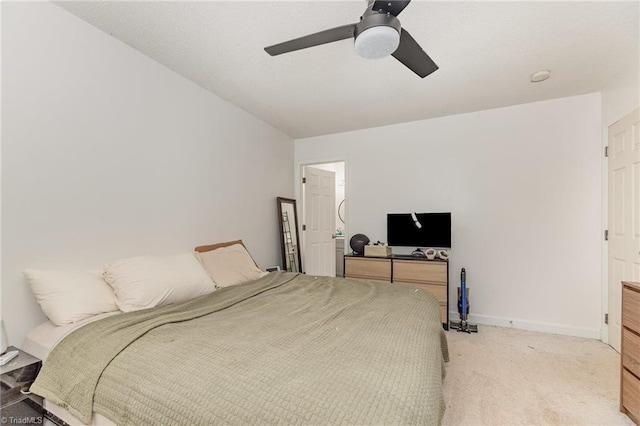 bedroom featuring baseboards, carpet floors, and a ceiling fan