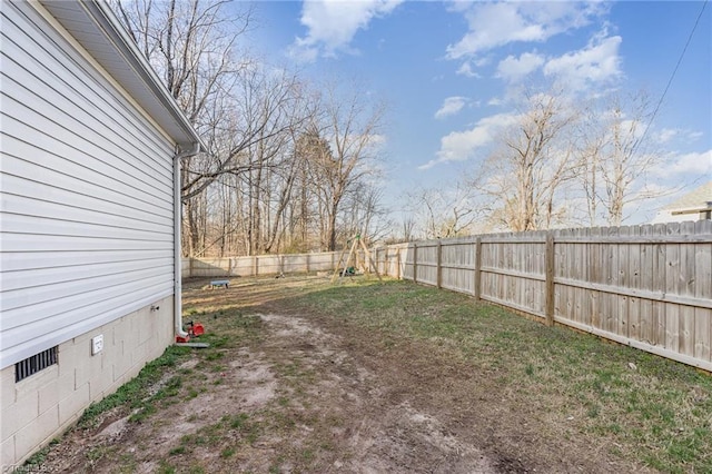 view of yard with a fenced backyard