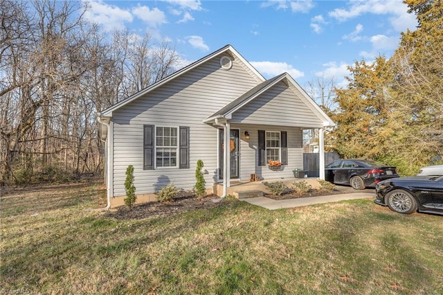 bungalow with a porch and a front lawn