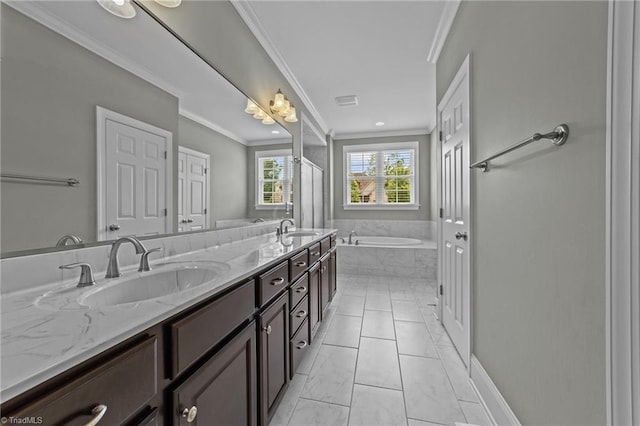 bathroom featuring a garden tub, double vanity, ornamental molding, and a sink