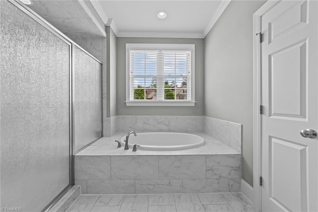 full bathroom featuring a shower stall, a garden tub, and crown molding