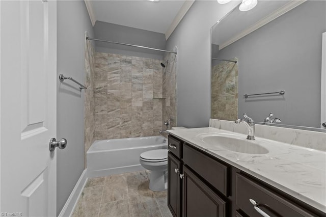 bathroom featuring crown molding, toilet, vanity,  shower combination, and baseboards