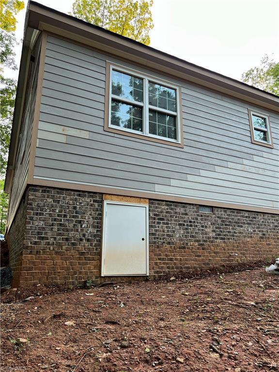 3710 Keith St, Greensboro, NC 27405 - view of side of property featuring brick siding