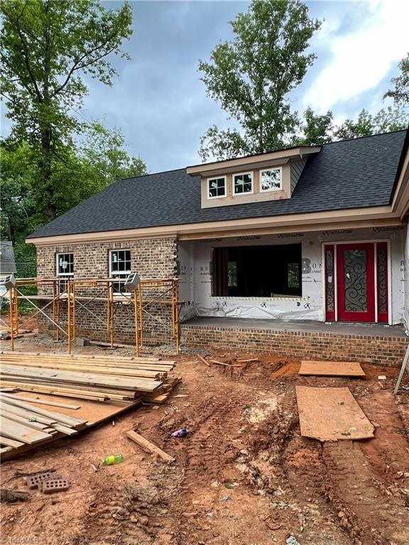 3710 Keith St, Greensboro, NC 27405 - view of front of home featuring brick siding, roof with shingles, and a deck