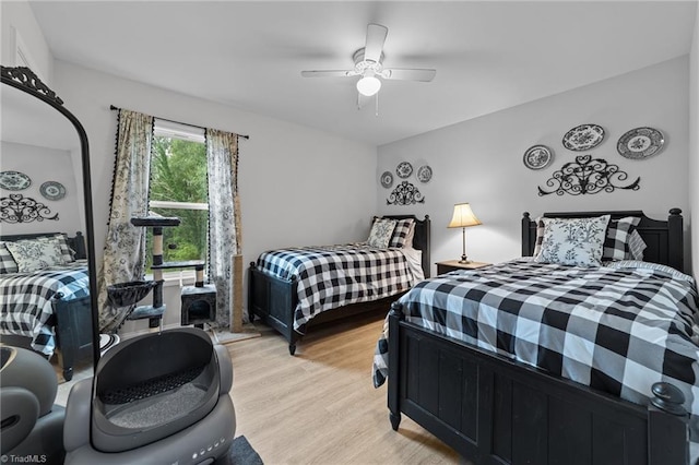 bedroom featuring ceiling fan and light hardwood / wood-style floors