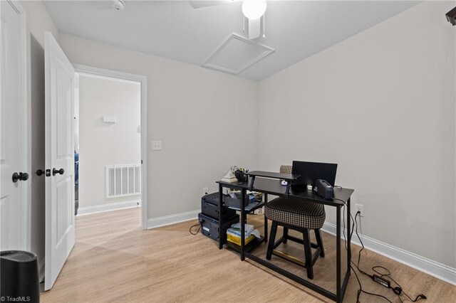 office featuring light wood-type flooring and ceiling fan