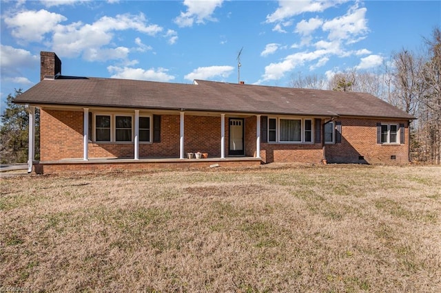 ranch-style home with a front lawn