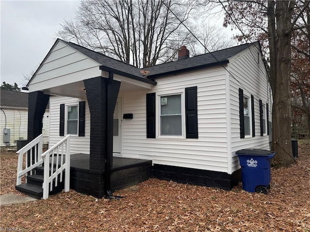 view of front of property featuring central air condition unit and a porch