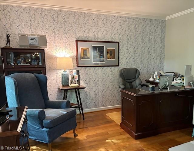 office featuring crown molding, baseboards, and wood finished floors