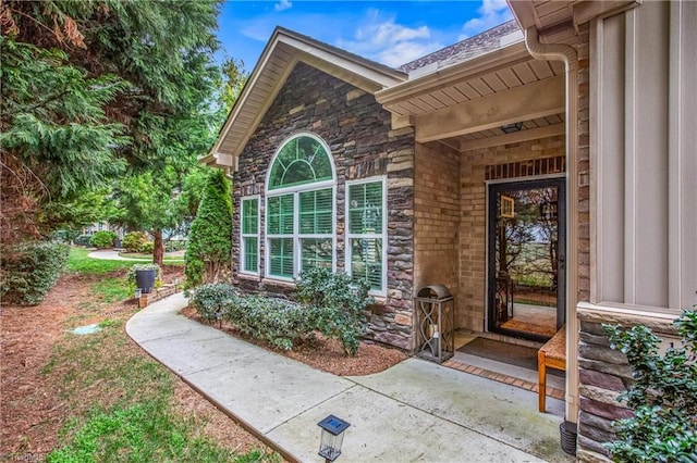 property entrance with stone siding