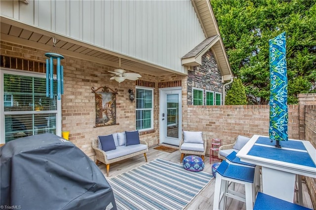 view of patio / terrace featuring outdoor lounge area, a grill, a ceiling fan, and fence