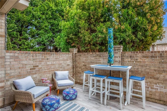 deck with fence and an outdoor living space