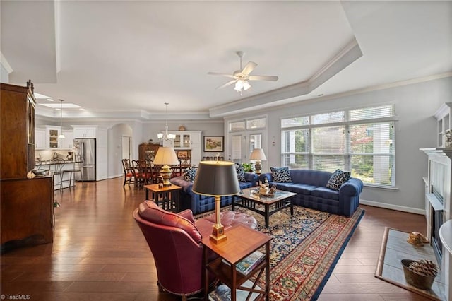 5905 Knowledge Dr, Clemmons, NC 27012 - living area with a fireplace with flush hearth, a raised ceiling, ceiling fan, crown molding, and a chandelier