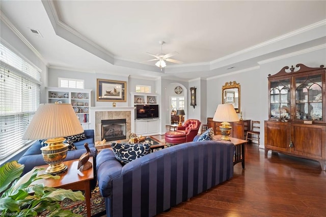 5905 Knowledge Dr, Clemmons, NC 27012 - living room featuring a tray ceiling, crown molding, ceiling fan, wood finished floors, and a fireplace