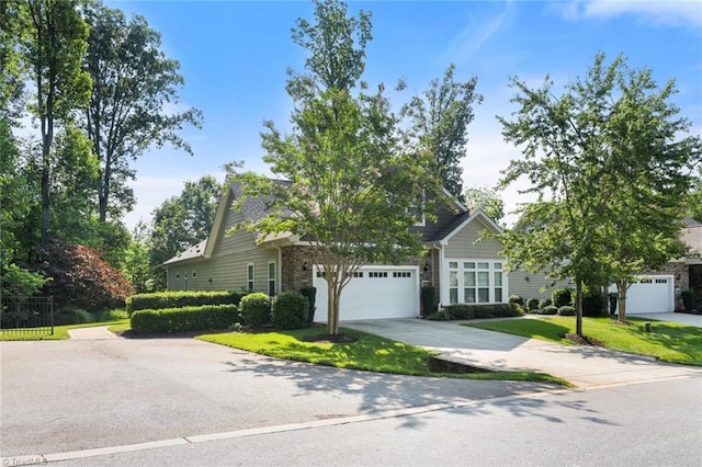 5905 Knowledge Dr, Clemmons, NC 27012 - obstructed view of property featuring stone siding, concrete driveway, and a garage