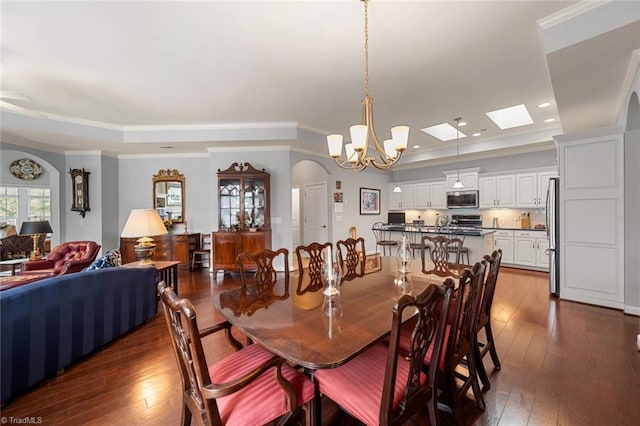 5905 Knowledge Dr, Clemmons, NC 27012 - dining space with dark wood-style flooring, recessed lighting, a raised ceiling, crown molding, and a chandelier
