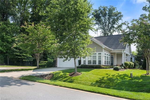 5905 Knowledge Dr, Clemmons, NC 27012 - view of property hidden behind natural elements featuring concrete driveway, a front yard, and a garage
