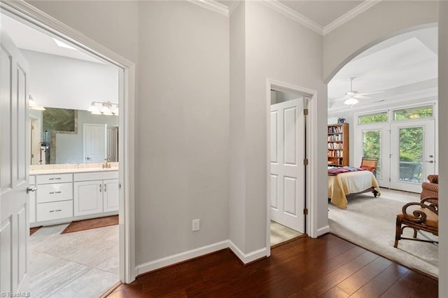 5905 Knowledge Dr, Clemmons, NC 27012 - hall with baseboards, crown molding, light wood-type flooring, and arched walkways