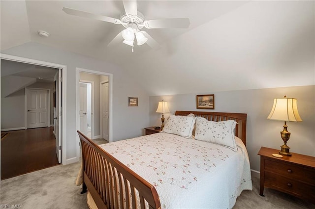 5905 Knowledge Dr, Clemmons, NC 27012 - carpeted bedroom with vaulted ceiling, baseboards, and ceiling fan