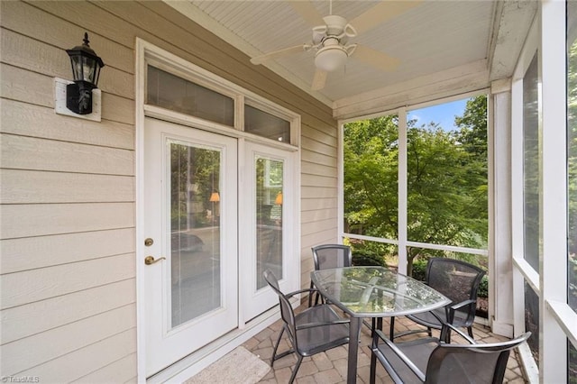 5905 Knowledge Dr, Clemmons, NC 27012 - sunroom / solarium featuring ceiling fan, wood walls, and outdoor dining area