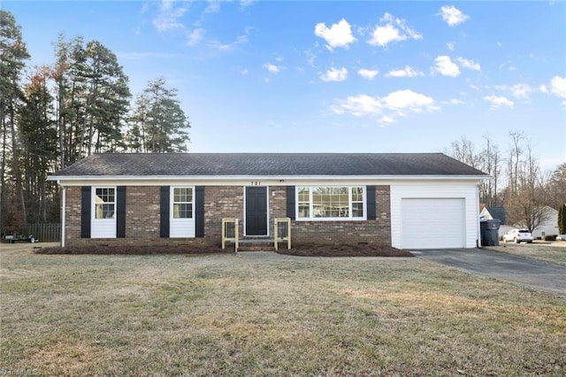 ranch-style house with a garage and a front lawn