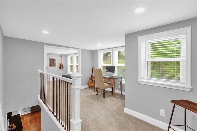 office area with baseboards, recessed lighting, and light colored carpet