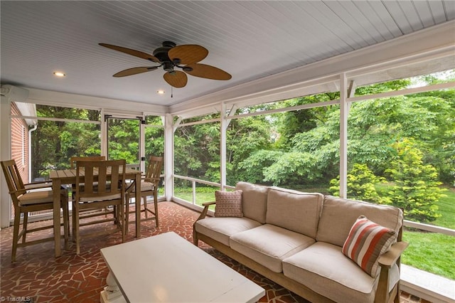 sunroom with an outdoor hangout area, outdoor dining space, a ceiling fan, healthy amount of natural light, and recessed lighting