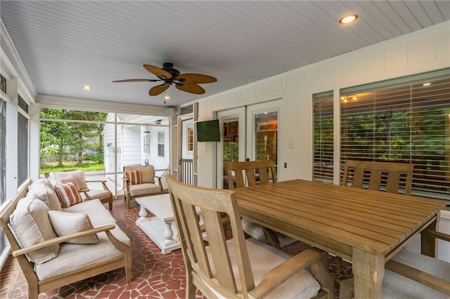 sunroom / solarium featuring a ceiling fan, french doors, an outdoor hangout area, and outdoor dining space