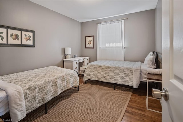 bedroom featuring dark hardwood / wood-style floors