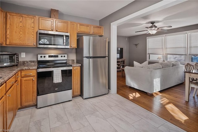 kitchen featuring appliances with stainless steel finishes and ceiling fan