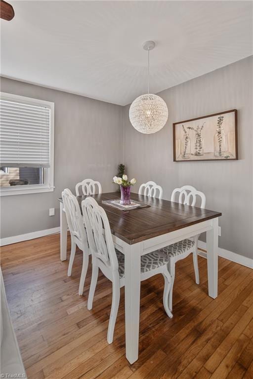 dining area with hardwood / wood-style floors