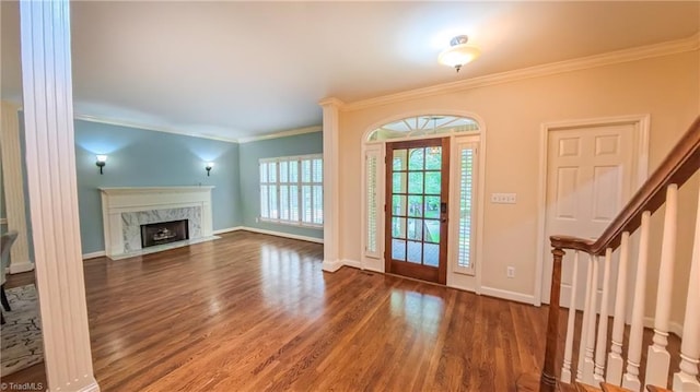 1005 Fallbrook Ln, Lewisville, NC 27023 - foyer featuring wood finished floors, crown molding, a fireplace, baseboards, and stairs