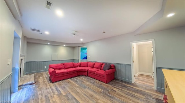 1005 Fallbrook Ln, Lewisville, NC 27023 - living area featuring wainscoting, wood finished floors, and recessed lighting