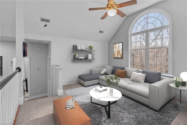 living room featuring light carpet, vaulted ceiling, visible vents, and baseboards