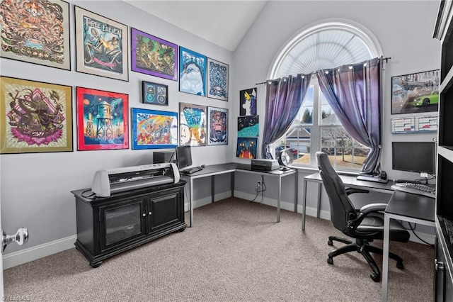 office featuring lofted ceiling, baseboards, and light colored carpet